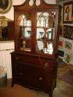 We are selling a beautiful mahogany 1940s Hepplewhite china closet 