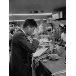  Senator John F. Kennedy Drinking a Cup of Coffee at a Cafe 