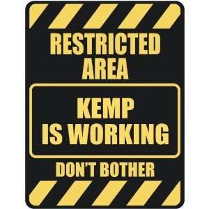   RESTRICTED AREA KEMP IS WORKING  PARKING SIGN