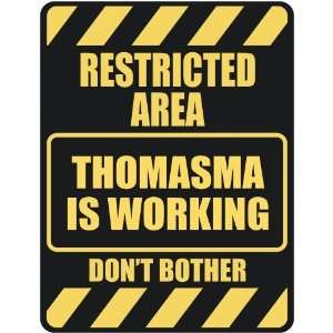   RESTRICTED AREA THOMASMA IS WORKING  PARKING SIGN