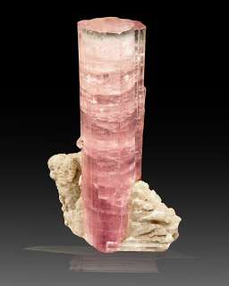 Lovely striated hot pink crystal on white 
