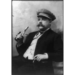   man drinking a bottle of Schlitz beer,smoking a cigar,c1906 Home