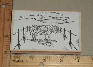SPOTTED COW IN FENCED PASTURE RUBBER STAMP  