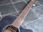   , sides & neck, a Rosewood bridge & fretboard, and Abalone rosette