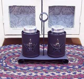   metal salt and pepper caddy with cutout stars and two clear glass