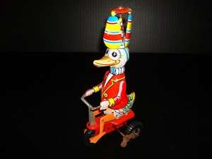 VINTAGE~WIND UP DUCK ON A TRICYCLE MADE IN W. GERMANY  